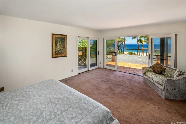 Second bedroom on the main ground floor with direct access to the pool and beach front.