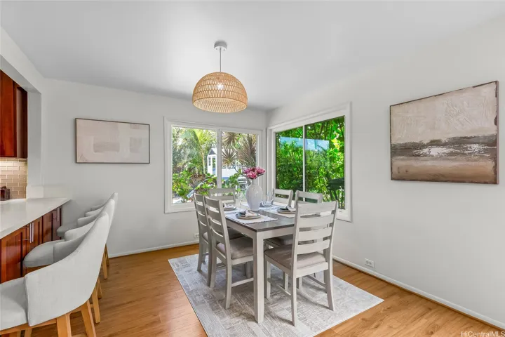 Dining area with backyard views.