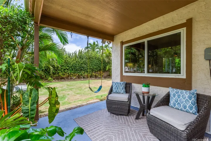 Covered patio area that leads to the backyard. Nice level lot with low maintenance yard.