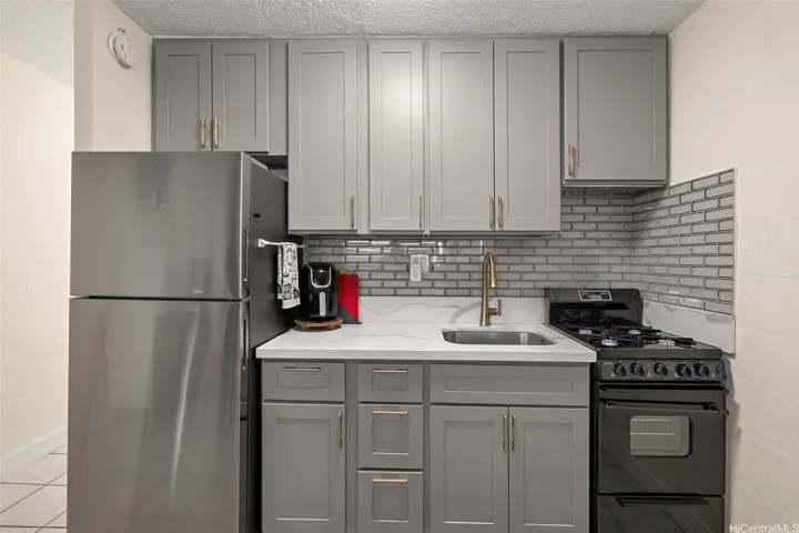 Newly designed kitchen offers lots of cabinet space and a new
range/oven, and refrigerator.
