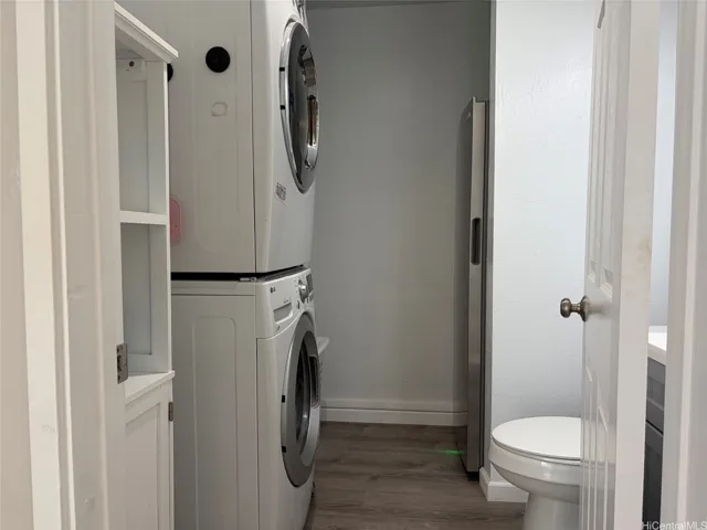 Half bath laundry room with storage near front door