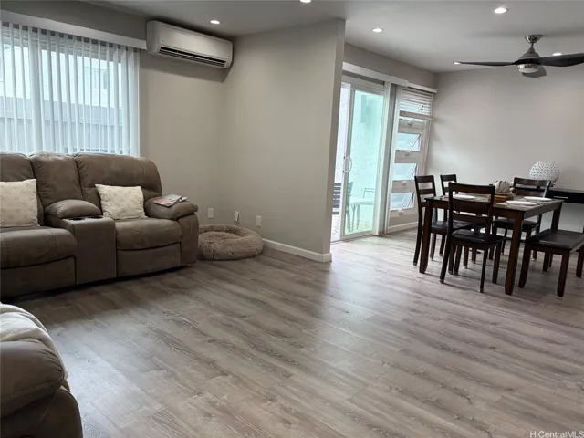 Living room view towards dining room and back lanai door