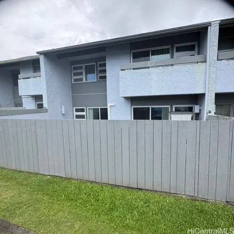 Back view the property with recently renovated fencing and access gate