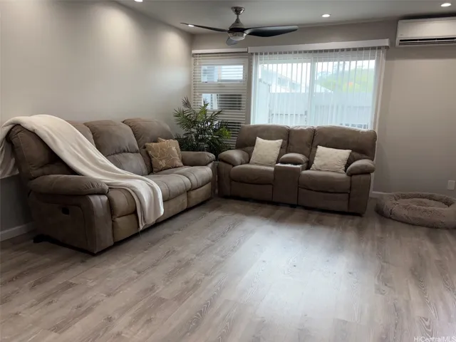 Spacious living room with split AC unit