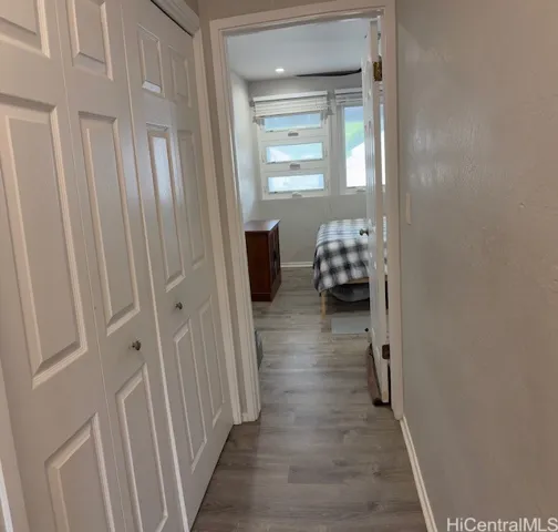Hallway to bedroom 3 with lots of storage
