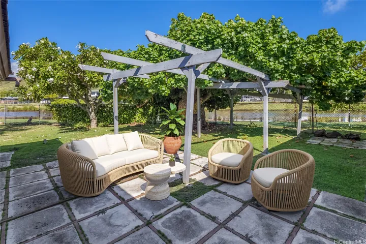 Enhanced.  Outdoor area between the carport and the main house