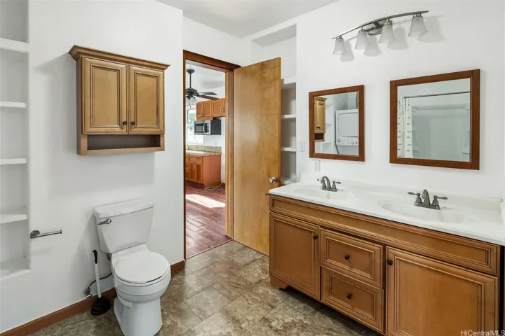 bathroom of 2/1 with double sinks and washer/dryer