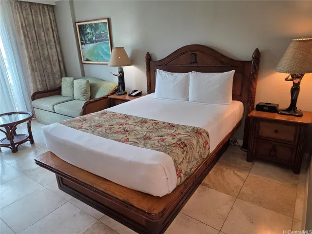 Impeccably maintained by Housekeeping.  Includes 2 end tables, 2-Seater Sofa, Coffee Table, Lamps, Radio, Phone, and all Art Work pieces.