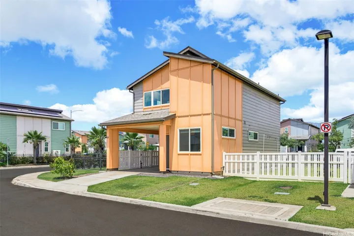 Welcome home to Ho‘opili! This desirable residence features a preferred parking configuration with both a carport and enclosed garage
