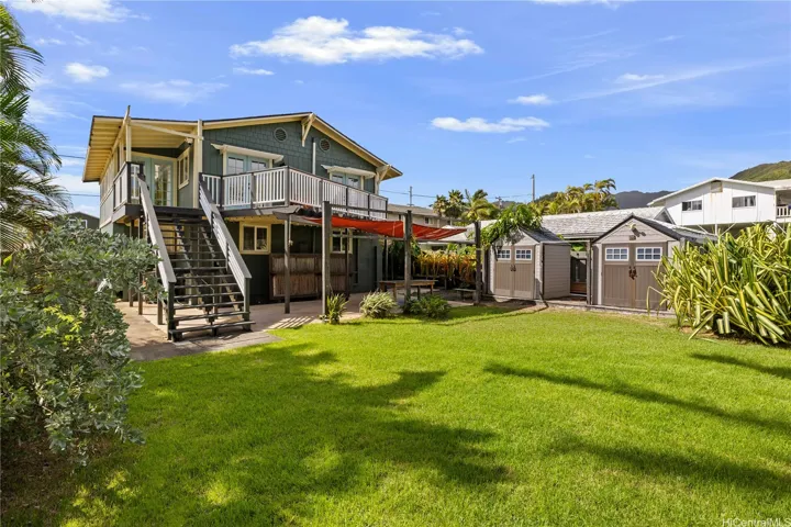 Large backyard with storage sheds.