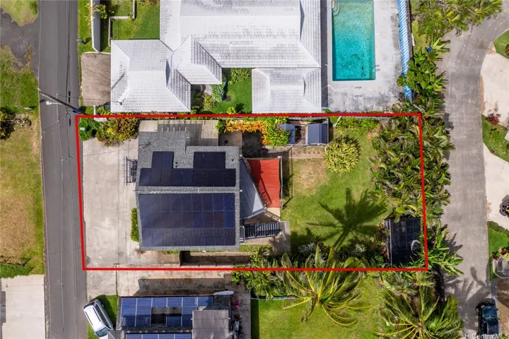 Overhead view shows parking and yard space.