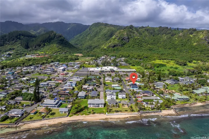 Beach and hikes in the background. Hauula Loop trail is in the pine trees a minute drive away.
