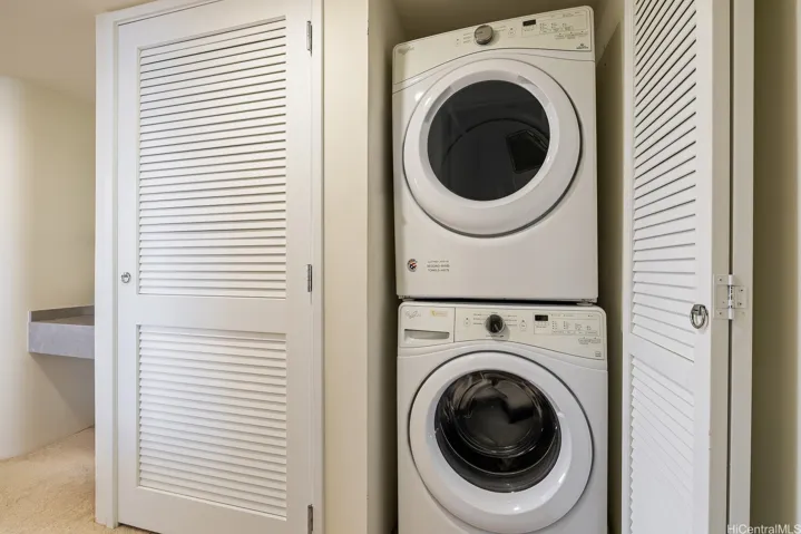 Full size stack washer/dryer conveniently located next to primary bedroom.