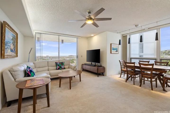 Bright & airy living room to dining area with tons of light.