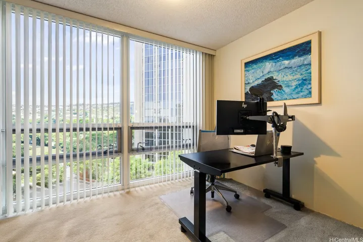 Bedroom #2 with huge windows used as office.