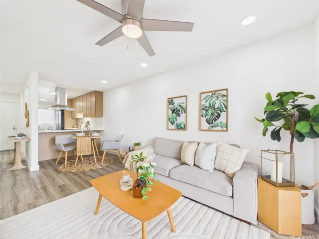 Open living and dining flow with new luxury vinyl plank flooring throughout