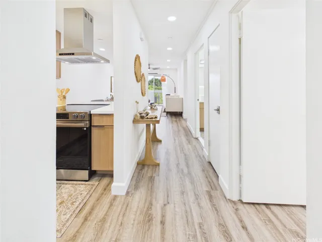 New flooring and recessed lighting carry from the entry to the lanai
