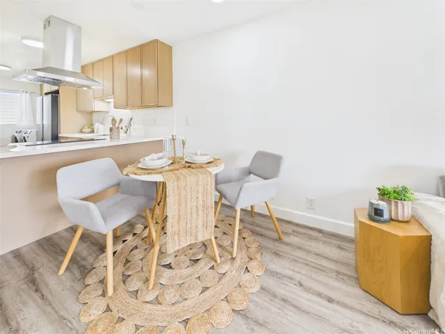 Dining nook opens to the kitchen breakfast bar