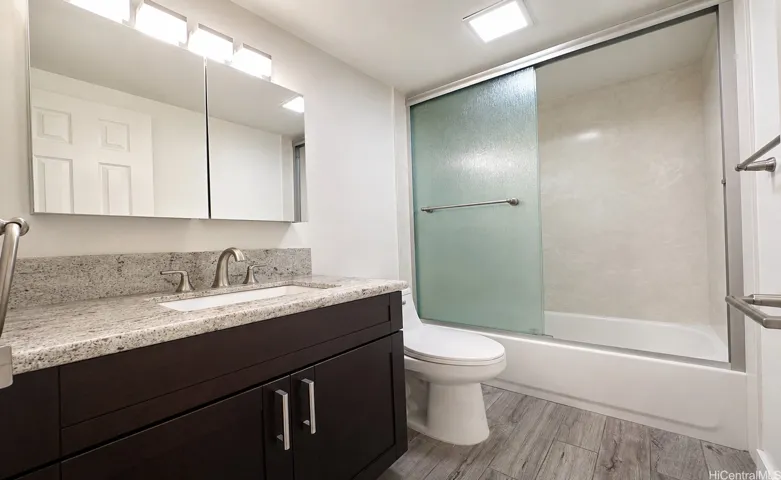 Hallway bathroom with a bathtub.