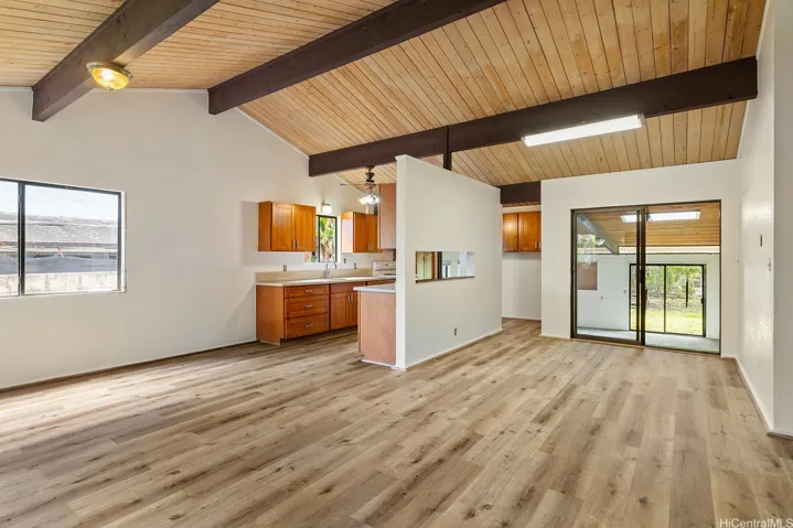 The living room is spacious & vaulted ceilings keep it cool.