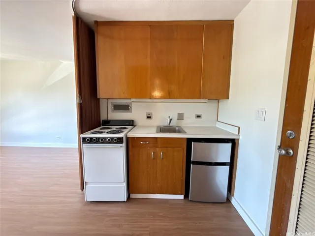 Quaint and efficient kitchen designed for studio living.