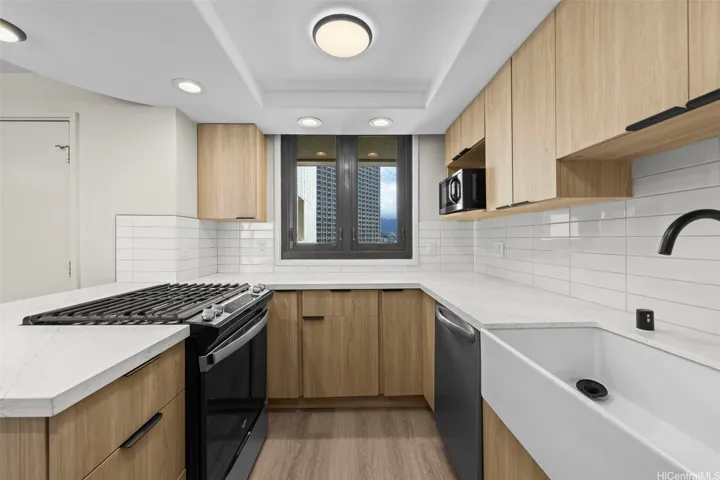 Spacious kitchen featuring a farmhouse sink.