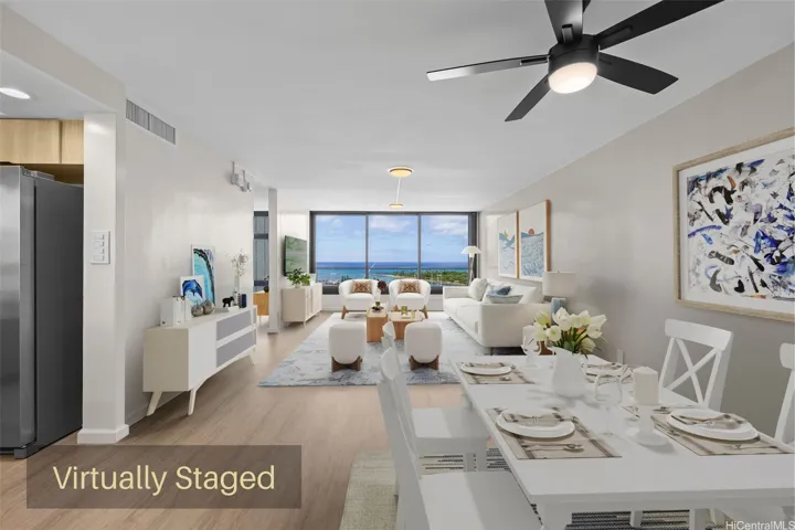 Bright and spacious open-concept living room layout featuring expansive floor-to-ceiling windows that showcase stunning, unobstructed panoramic ocean views.