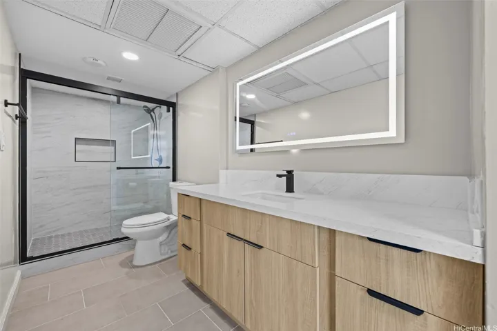Experience this custom-designed, fully renovated bathroom, which showcases a sophisticated modern aesthetic, premium high-end fixtures, sleek contemporary cabinetry, and exquisite finishes throughout that provide a spa-like retreat within the comfort of your own home.