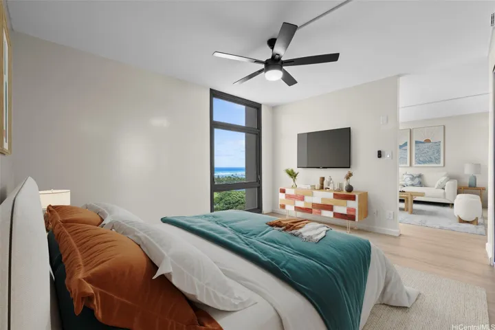 This beautifully staged bedroom space is filled with an abundance of natural light, creating a bright, warm, and inviting atmosphere that is perfect for relaxation. The room features tasteful decor and professional staging designed to showcase its full potential, making it an appealing highlight for prospective buyers viewing the property. Enhanced