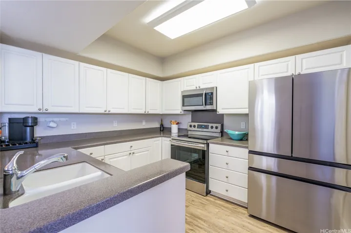Large Kitchen with Newer Stainless Steel Appliances, Corian Countertops
