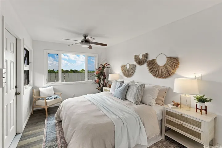 Fourth bedroom featuring large windows that invite cool trade winds and offer beautiful views.
