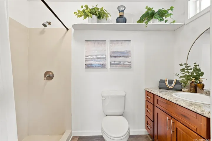 Ample sized full bathroom in the fourth bedroom featuring a low step-over tub entry.
