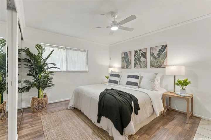 Another spacious primary suite featuring two separate closet areas.