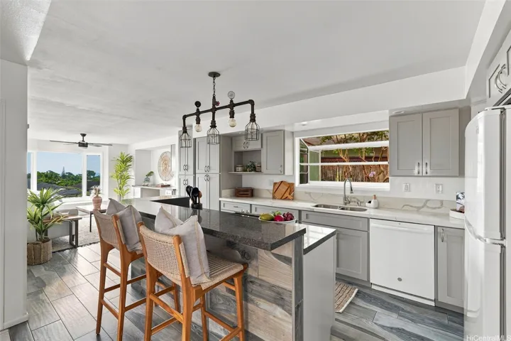 Welcome to your remodeled & newly painted home in Hokulele! BRAND NEW ROOF & gutters, PV solar panels, solar water heater, & solar attic fan are just a few of the upgrades this home has to offer