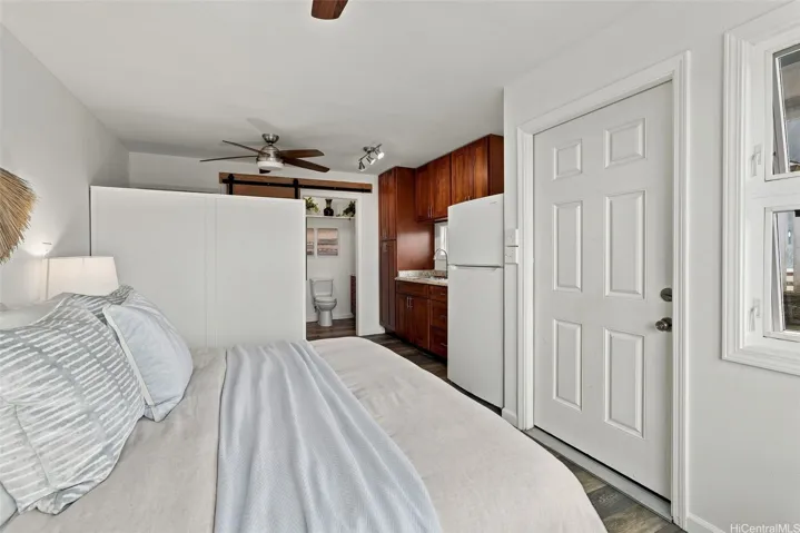 Fourth bedroom featuring an en-suite full bath and a wet bar for added convenience.
