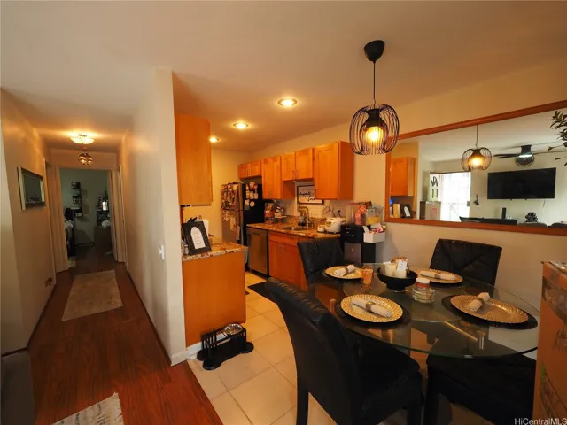View of Dining/Kitchen and Hallway, 2nd Bedroom to left, Jack & Jill Bath to right, and Primary in background.  Very Functional floorplan that is also "Ground Floor"!  No stairs!