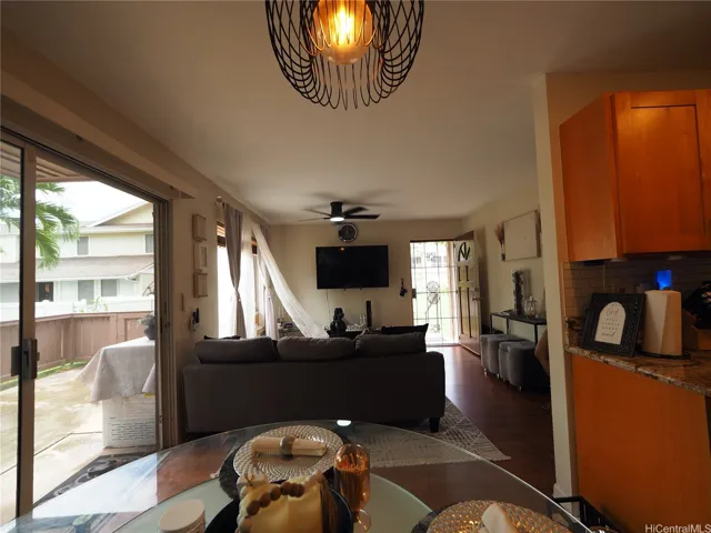 Mostly natural light looking towards the Entry, so serence and beautiful!  Do not miss the HUGE fenced cement Patio to left, even MORE room for Storage and fresh outdoor space!