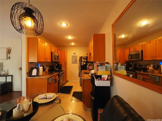 Beautifully upgraded Kitchen with Granite Countertops, newer Cabinetry, quality Gas Stove, Large Ceramic Tile Flooring is so warm & beautiful!