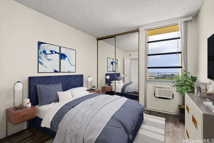 First bedroom. Virtually staged. Window AC and white blinds.