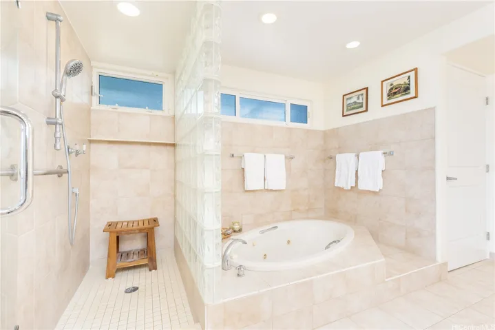 Primary bathroom, walk in shower and expansive soaking tub.