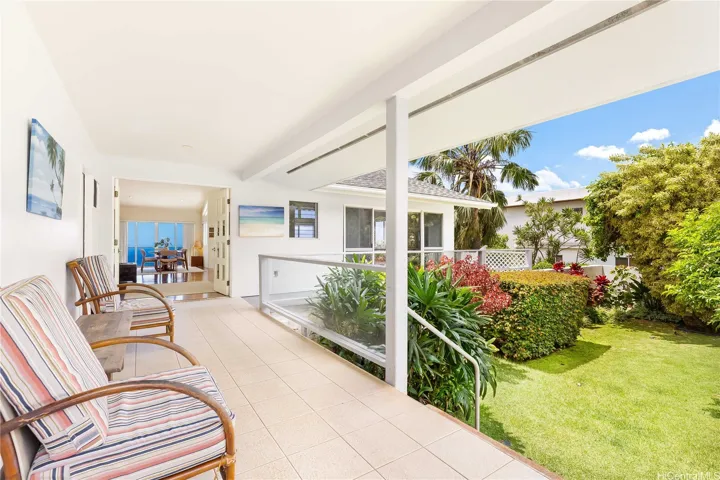 Welcome home to your own private oasis, featuring a secure, covered lanai and two sets of elegant double-door entrances.