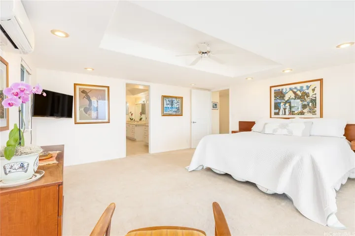 Spacious primary suite featuring a luxurious ensuite bath and an expansive walk-in closet.