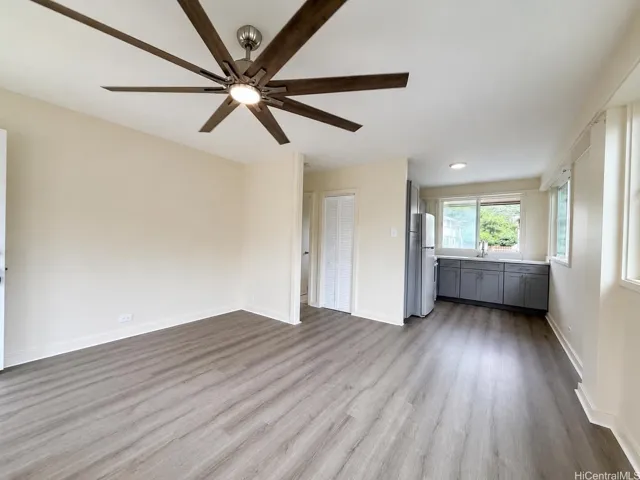 Spacious livingroom, new windows (UV coating), curtain rods and brand-new vinyl plank flooring