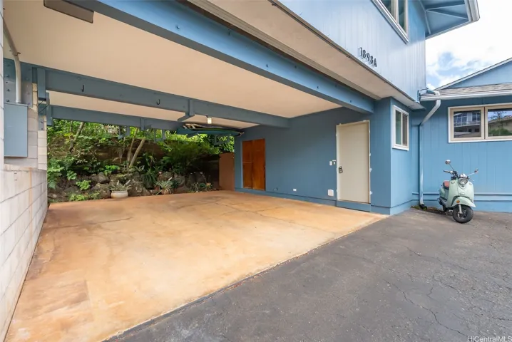 Carport with laundry for main house and entry to guest house