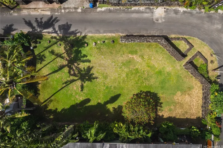 7,250 sq feet of vacant land on Sunset Point, steps to the beach, and  enclosed by a rock wall