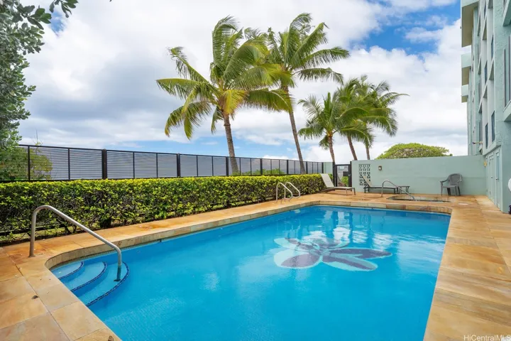 Sparkling swimming pool on property.