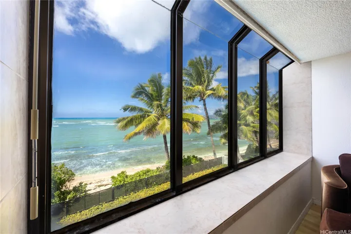 Large windows in main living area provide incredible ocean views and natural light.