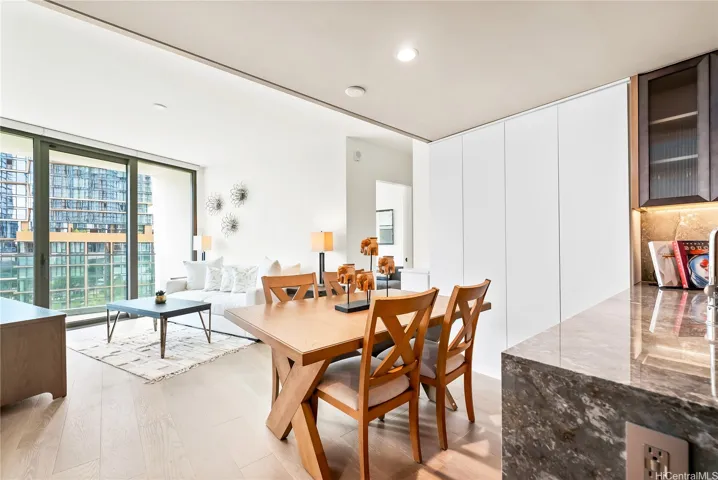 Dining space with floor to ceiling built in cabinets added for extra pantry room.
