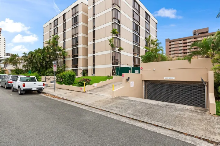 Piikoi Atrium exterior with gated parking entrance