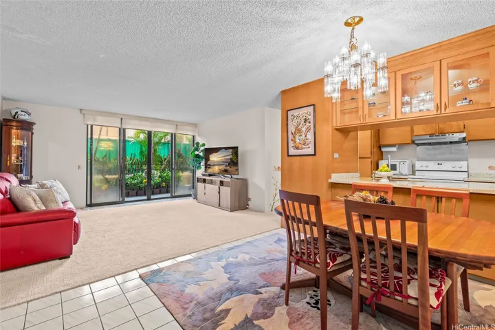 Open living and dining area with renovated kitchen